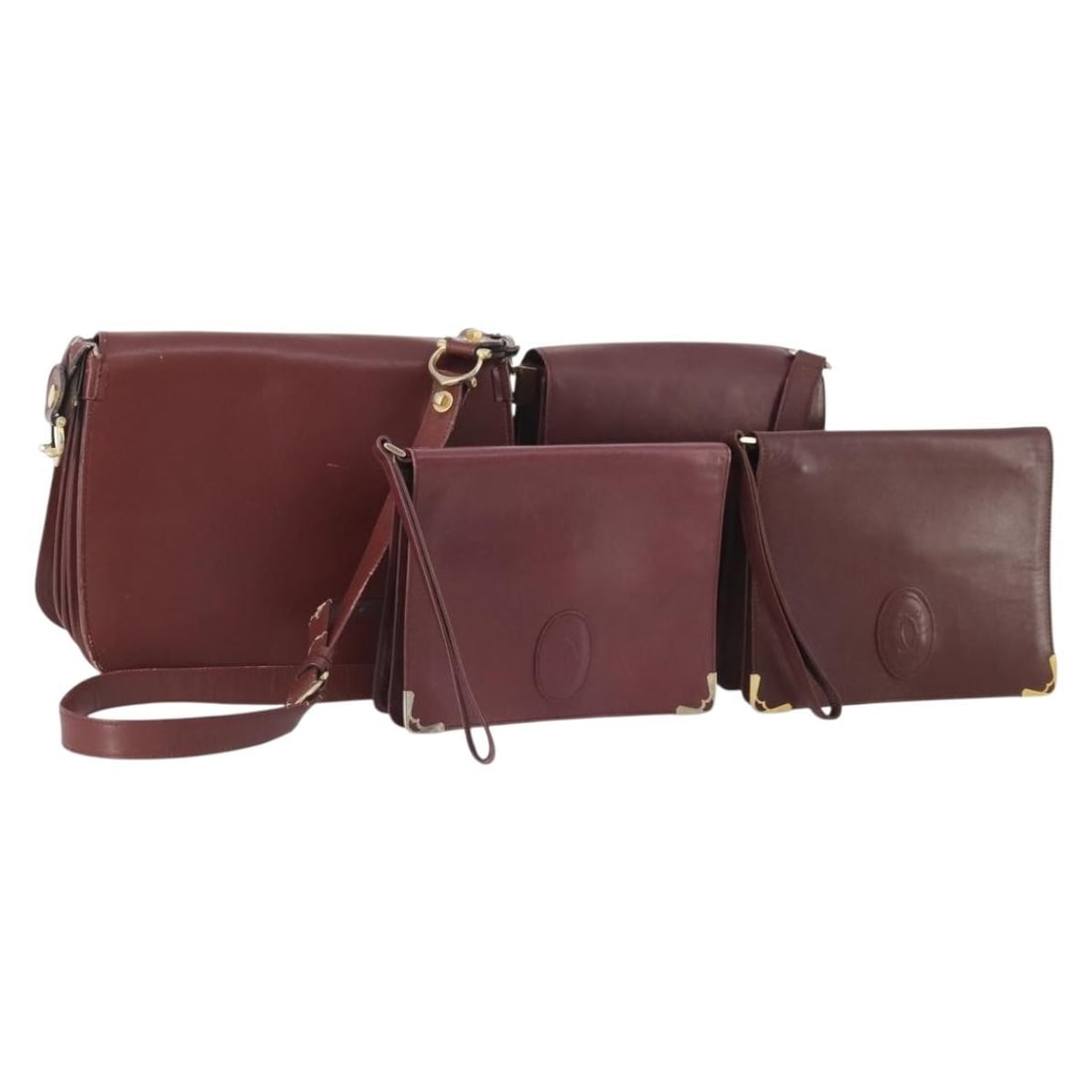 Cartier Must Line Bordeaux Gold Leather Shoulder Bag Set: Cartier Must Line Bordeaux Gold Leather Shoulder Bag Set This is a heavily used Cartier Must Line shoulder bag set crafted from leather in Bordeaux and gold tones. The set is designed for women and wa