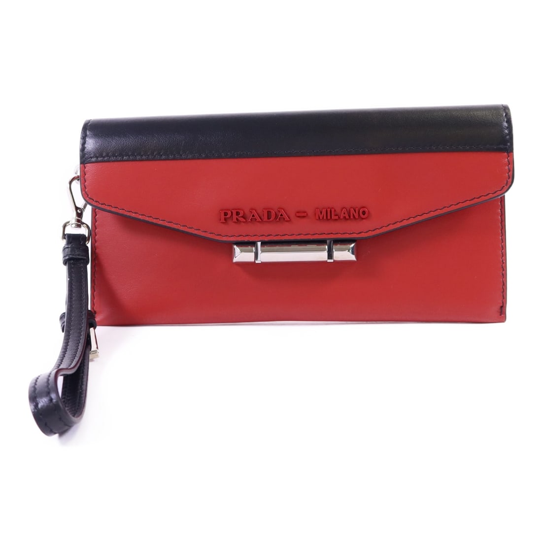 Red and Black Calfskin Prada Clutch Bag with Silver Tone Hardware: Red and Black Calfskin Prada Clutch Bag with Silver Tone Hardware This PRADA clutch bag is crafted from calfskin leather in a striking red color with black accents. It features a compact design, makin