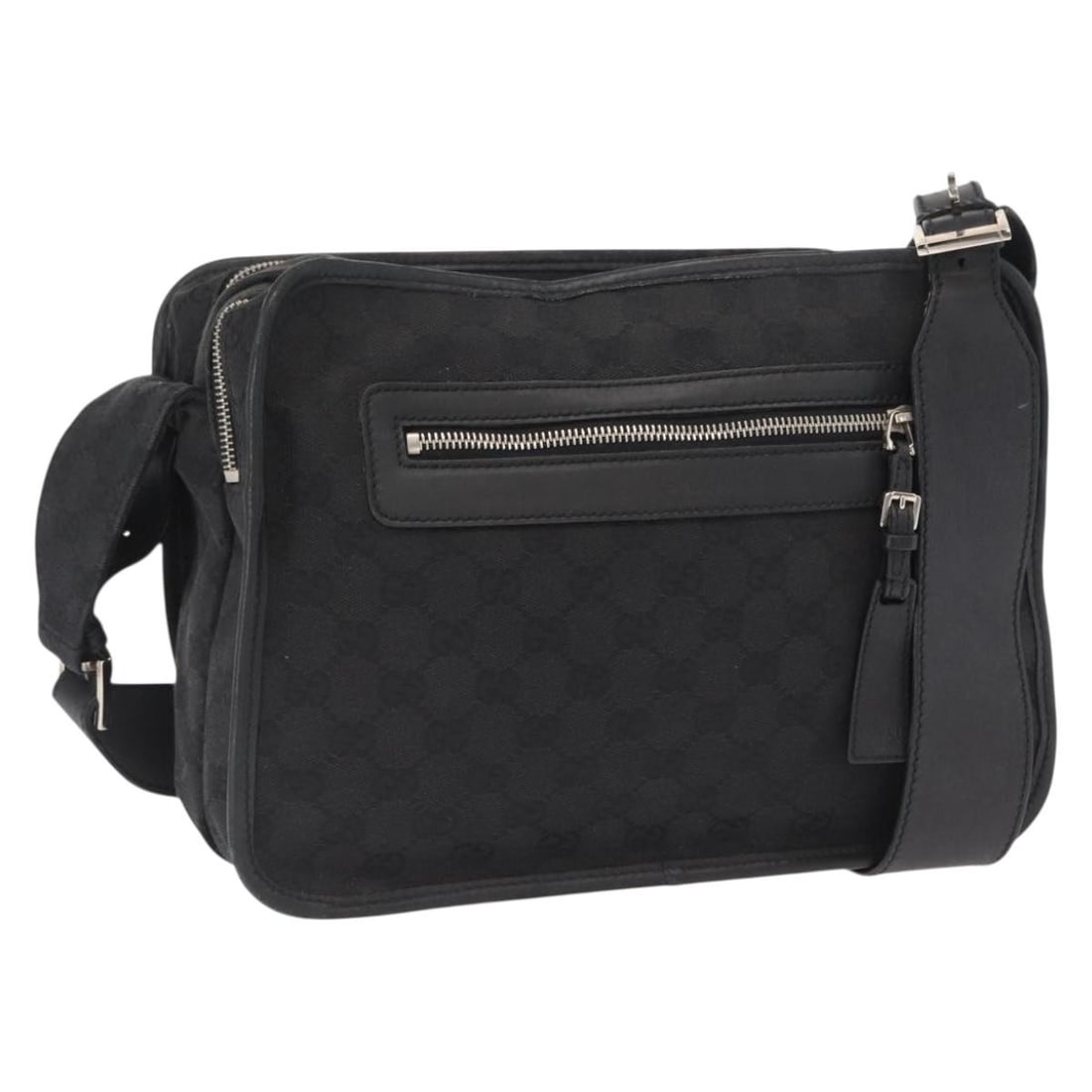 Black GG Canvas Shoulder Bag by Gucci with Silver Accents: Black GG Canvas Shoulder Bag by Gucci with Silver Accents This authentic GUCCI GG Canvas shoulder bag features a black and silver color scheme with the iconic GG canvas exterior. The bag has a spaciou