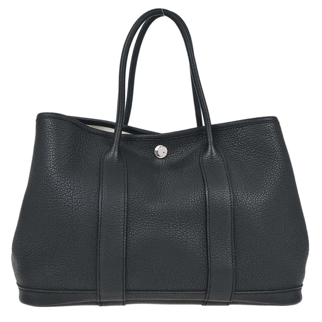 Hermes Garden Party 30 Black Leather Tote Bag: Hermes Garden Party 30 Black Leather Tote Bag This Hermes Garden Party 30 TPM tote bag is crafted from black Negonda leather and features double brown handles with a 4-inch drop. The tote is accented 