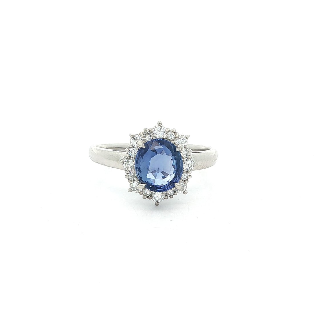 Platinum Ring with 1.9ct No Heat Ceylon Sapphire and Diamond Halo GIA Certified: Platinum Ring with 1.9ct No Heat Ceylon Sapphire and Diamond Halo GIA Certified This platinum cocktail ring showcases a 1.90 carat natural, no-heat Ceylon sapphire in an oval brilliant cut, prong-set 