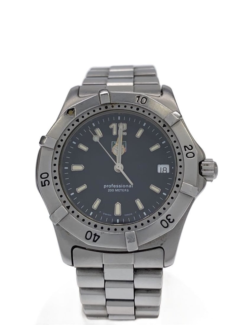 TAG Heuer Quartz Stainless Steel Men's Wristwatch 200 Meters: TAG Heuer Quartz Stainless Steel Men's Wristwatch 200 Meters This TAG Heuer Professional 200 Meters Quartz men's wristwatch features a classic black dial and a durable stainless steel case and band. S