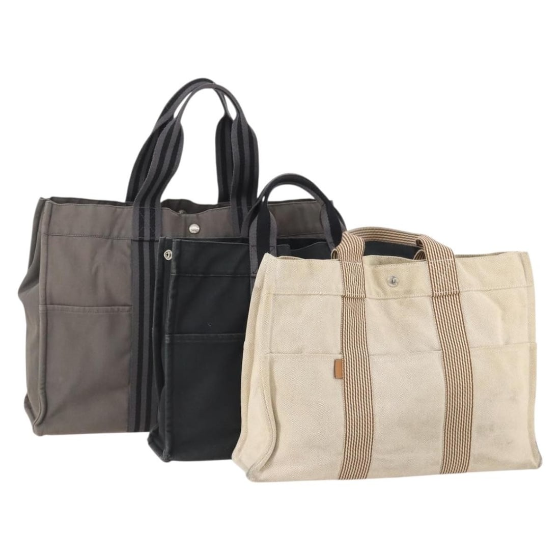 Hermes Fourre Tout MM canvas tote set of 3 gray black beige: Hermes Fourre Tout MM canvas tote set of 3 gray black beige This HERMES Fourre Tout MM hand bag set includes three canvas bags in gray, black, and beige tones. Designed for women, each bag is crafted 