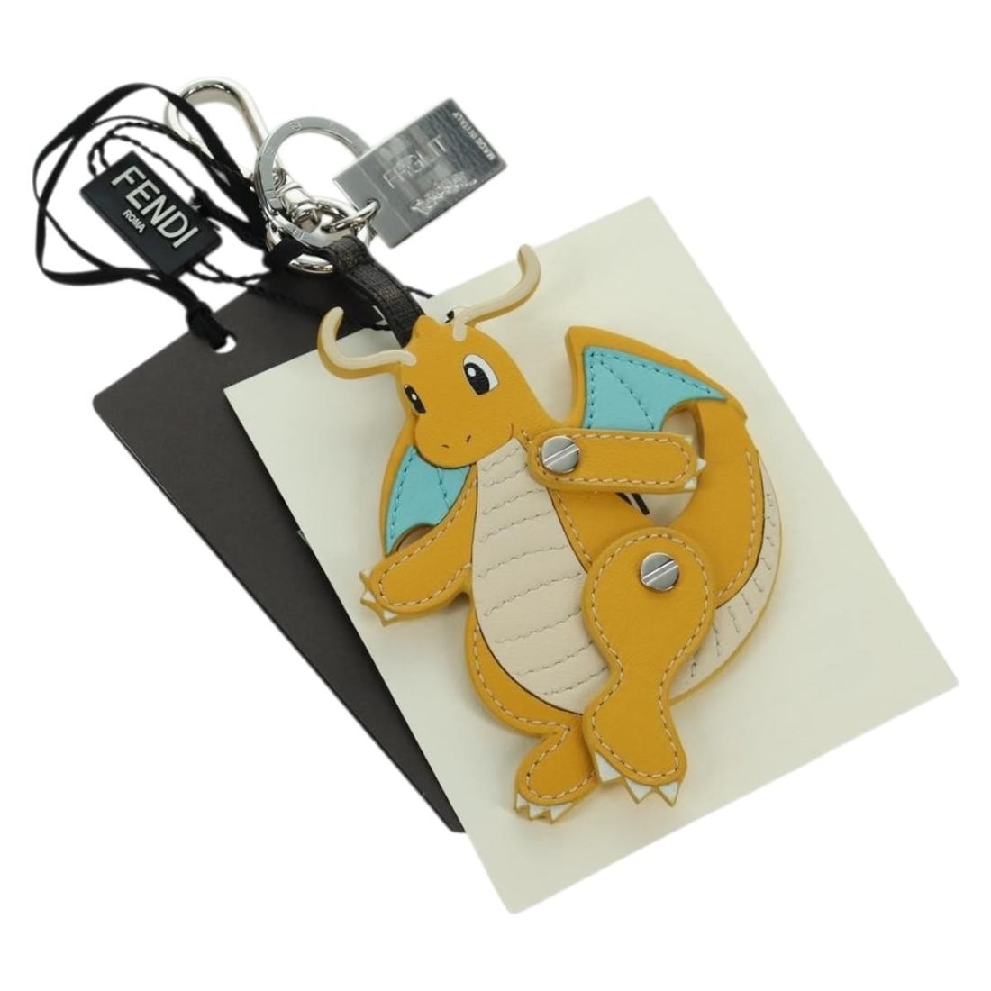 Fendi x Fragment x Pokemon Dragonite Yellow Leather Bag Charm: Fendi x Fragment x Pokemon Dragonite Yellow Leather Bag Charm This FENDI x FRGMT x POKEMON Dragonite charm is crafted from yellow leather and is designed for use as an accessory. The charm is made in 