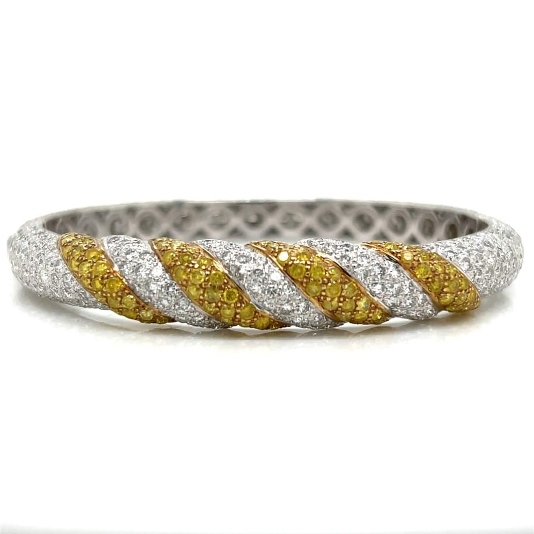 18K White Gold Bangle Bracelet with Fancy Yellow Diamonds: 18K White Gold Bangle Bracelet with Fancy Yellow Diamonds This exquisite 18K white gold bangle bracelet features a stunning array of fancy yellow diamonds. Weighing 24.8 grams, it is adorned with 100 