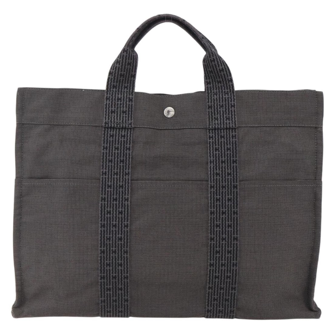 Fourre-tout Herline gray canvas tote bag by Hermes: Fourre-tout Herline gray canvas tote bag by Hermes The Hermes Fourre-tout Herline is a women's tote crafted from gray canvas. This bag features a spacious interior and sturdy handles, with signs of us
