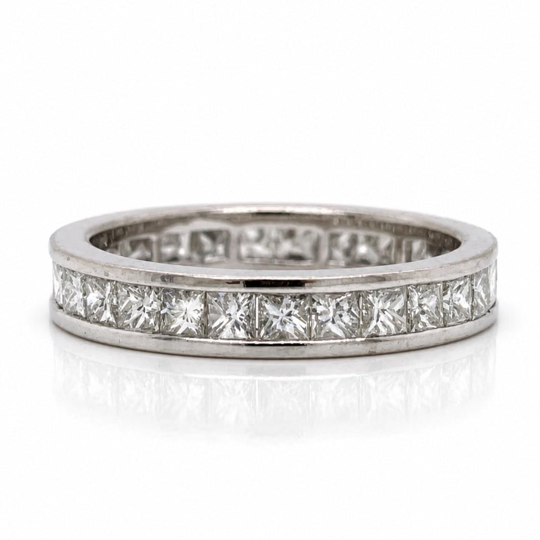 Diamond Eternity Ring 18K White Gold 2.10 Ct Princess Cut Size 7: Diamond Eternity Ring 18K White Gold 2.10 Ct Princess Cut Size 7 This elegant eternity band is crafted from 18K white gold and features approximately 2.10 carats of princess-cut diamonds. The diamonds