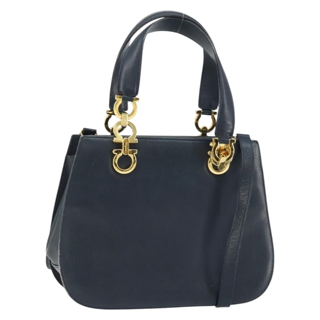 Salvatore Ferragamo Gancini Leather Navy Gold 2way Handbag with Shoulder Strap: Salvatore Ferragamo Gancini Leather Navy Gold 2way Handbag with Shoulder Strap This Salvatore Ferragamo Gancini handbag is crafted from navy leather with gold-tone accents. Designed for versatility, i