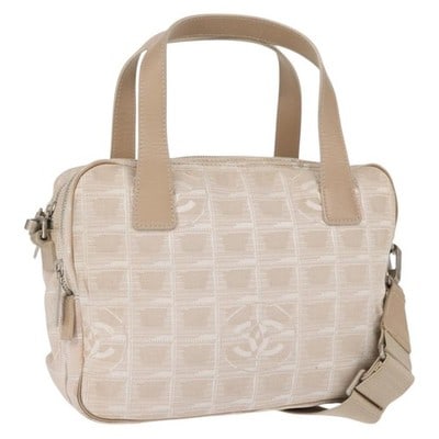 CHANEL Travel Line Pink Gold Canvas Leather 2way Hand Bag: CHANEL Travel Line Pink Gold Canvas Leather 2way Hand Bag This CHANEL Travel Line handbag features a pink and gold canvas exterior with leather accents. It can be carried by hand or worn over the shou