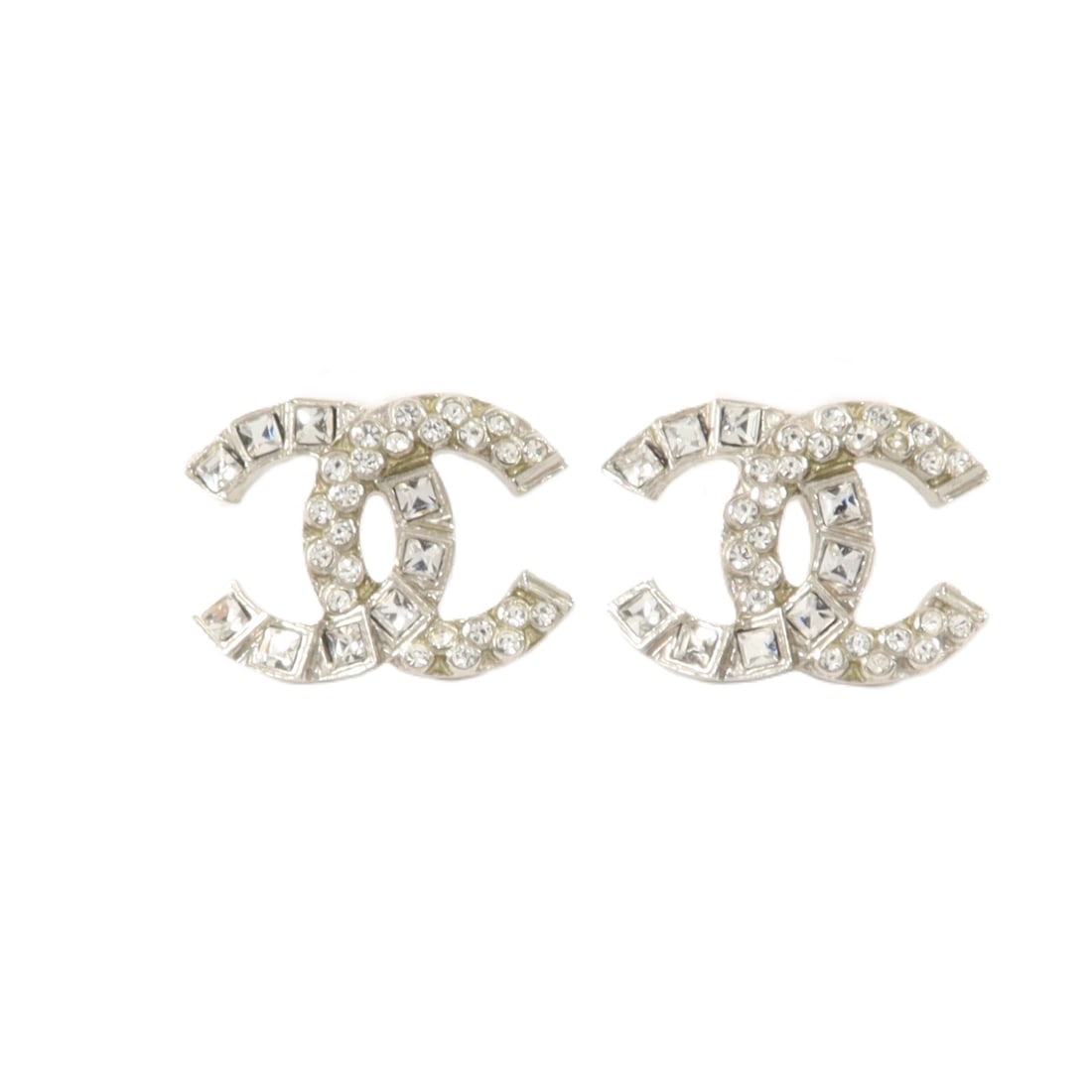 CHANEL Silver CC Pierced Earrings: CHANEL Silver CC Pierced Earrings These CHANEL CC pierced earrings feature a classic design crafted in silver-tone metal with the iconic CC logo. Designed for women, they are made in France and presen