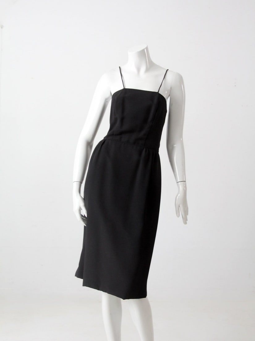 Classic Vintage Little Black Dress with Spaghetti Straps: Classic Vintage Little Black Dress with Spaghetti Straps Embrace timeless elegance with this vintage little black dress, a wardrobe staple that never goes out of style. Designed in a classic straight 