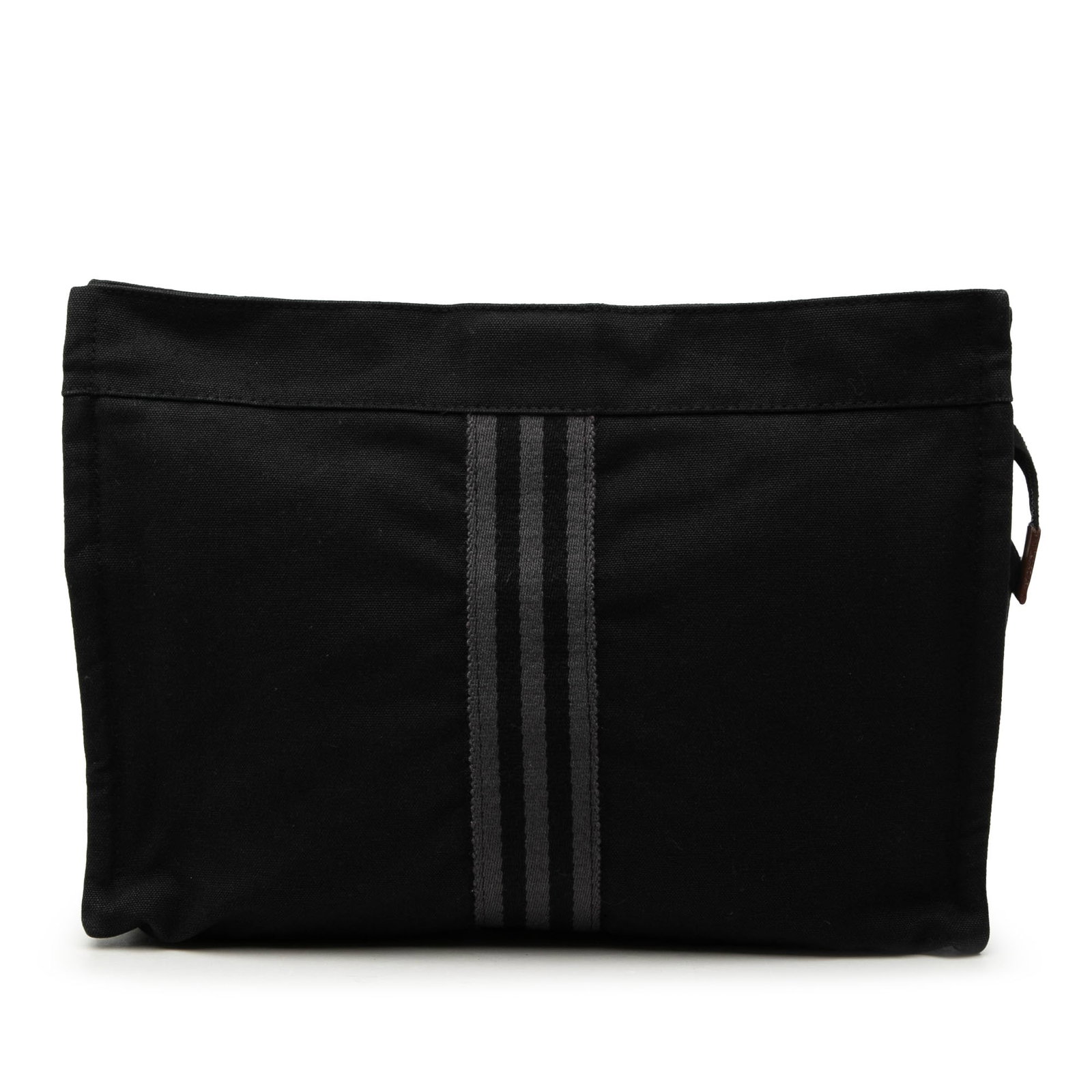Hermes Fourre Tout Canvas Zip Clutch Bag: Hermes Fourre Tout Canvas Zip Clutch Bag This Hermes Canvas Fourre Tout Clutch features a black fabric body with a top zip closure. Made in France, this clutch combines practicality with classic style
