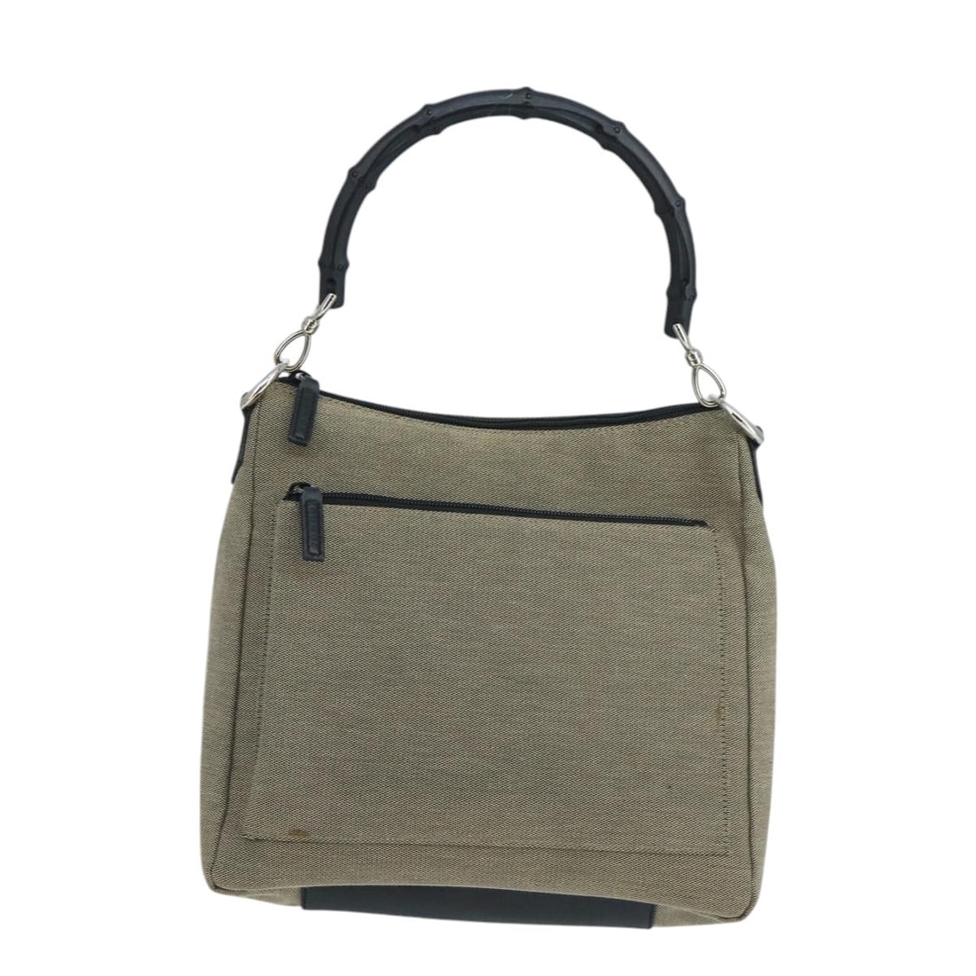 Gucci Beige Canvas Vintage Bamboo Shoulder Purse Italy: Gucci Beige Canvas Vintage Bamboo Shoulder Purse Italy This Gucci vintage bamboo shoulder bag features a beige canvas exterior with signature bamboo detailing. Designed for women, it offers a spacious