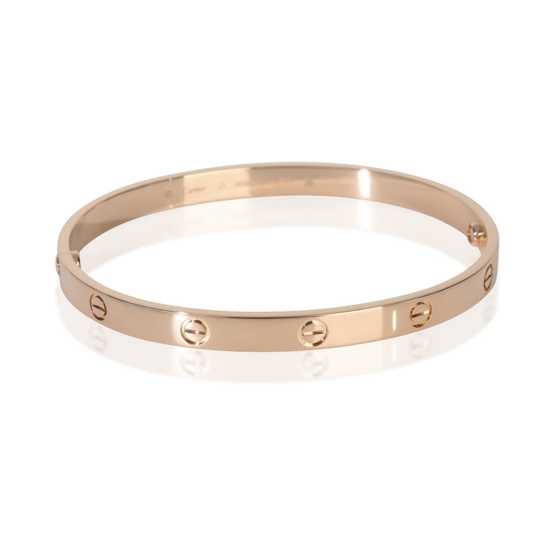 Cartier Love Bracelet 18k Rose Gold With Certificate and Screwdriver: Cartier Love Bracelet 18k Rose Gold With Certificate and Screwdriver This Cartier Love Bracelet is crafted from 18k rose gold and features a signature screw clasp. Designed for men, it measures 21 cm 