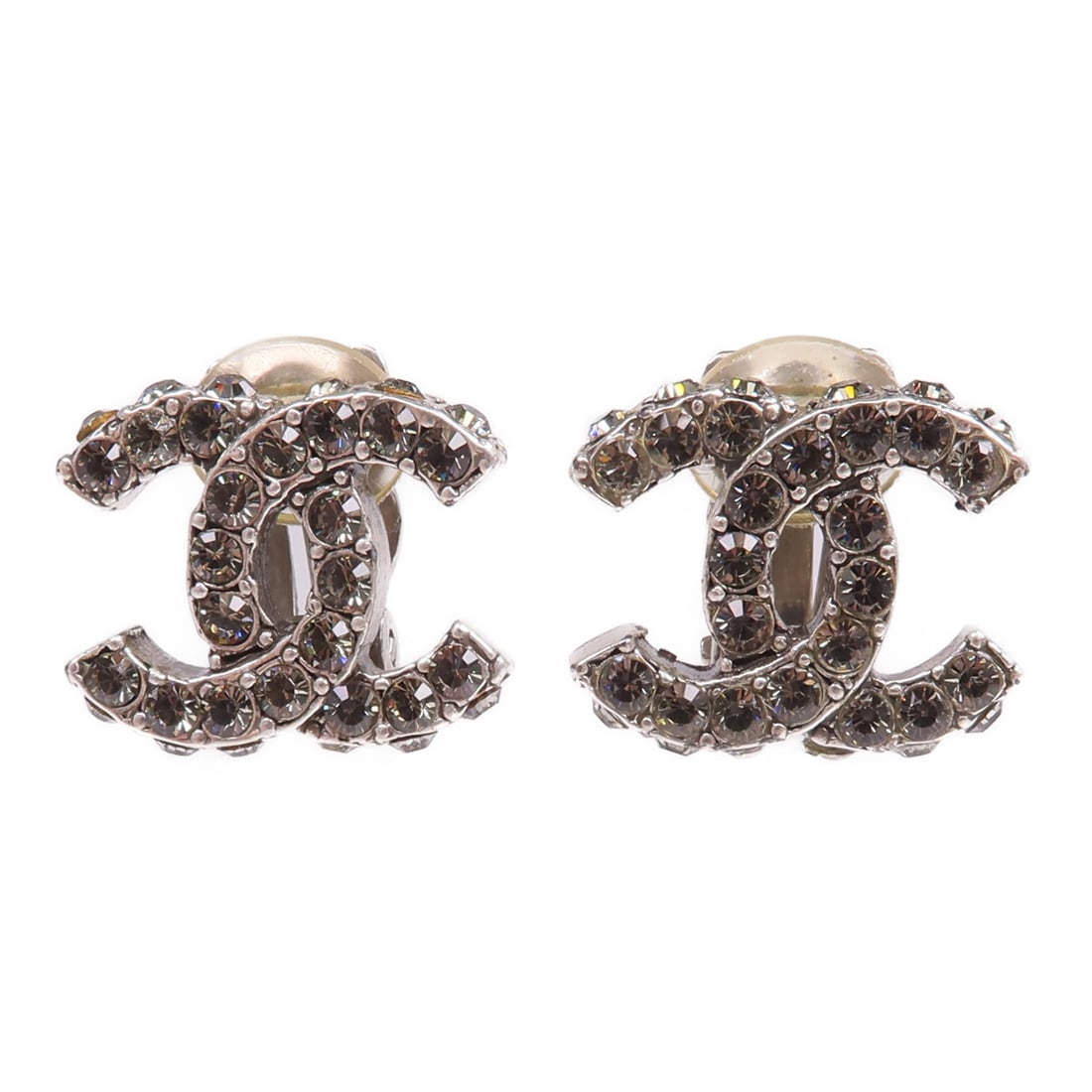 Chanel CC Silver Metal Earrings: Chanel CC Silver Metal Earrings These CHANEL CC earrings feature a silver-tone metal construction and display the iconic CC logo design. Made in France, they are crafted for women and do not include a