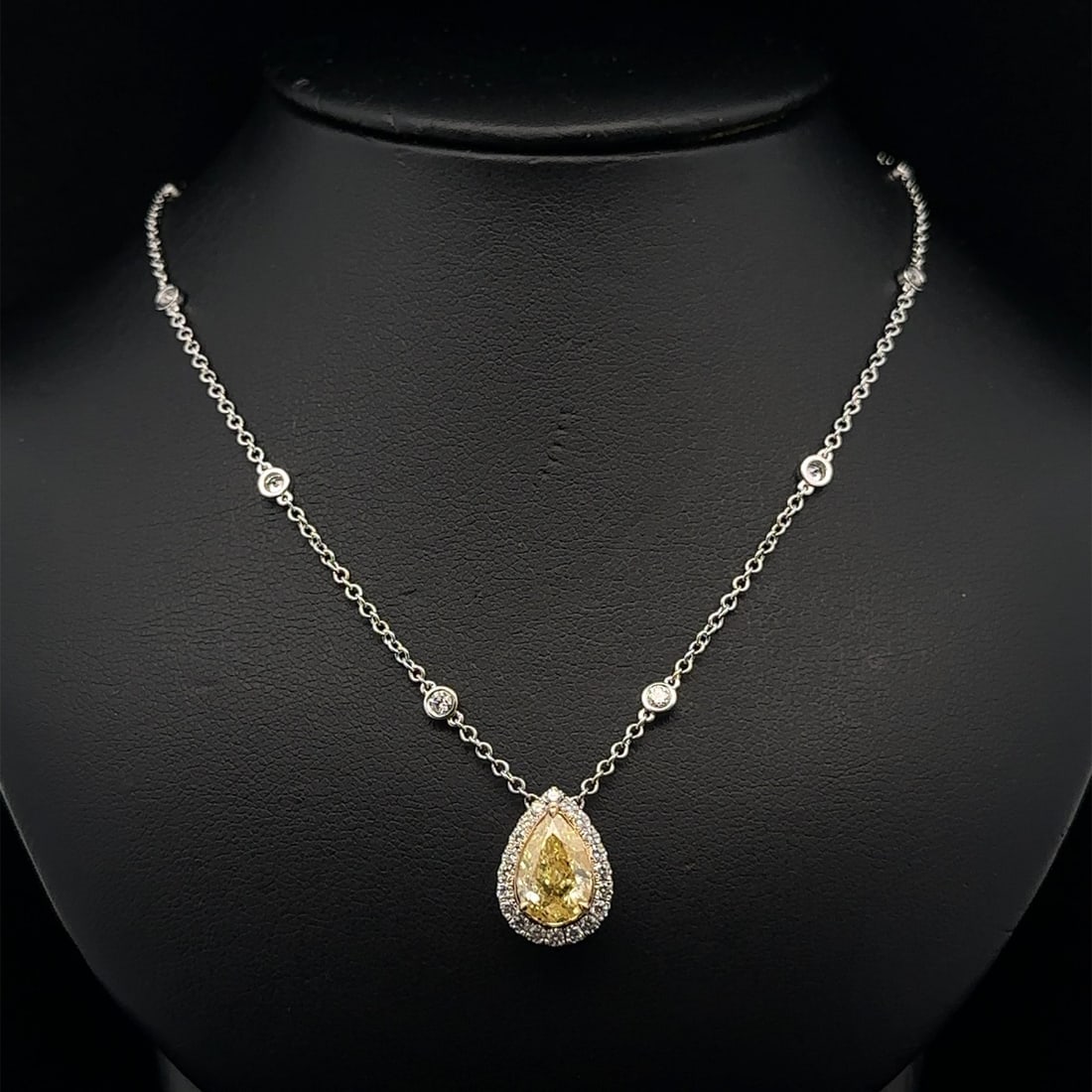 18k Gold GIA Certified 2.70ct Fancy Yellow Pear Diamond Pendant Necklace: 18k Gold GIA Certified 2.70ct Fancy Yellow Pear Diamond Pendant Necklace This stunning pendant necklace features a breathtaking 2.70 carat total weight, showcasing a natural fancy yellow pear diamond 