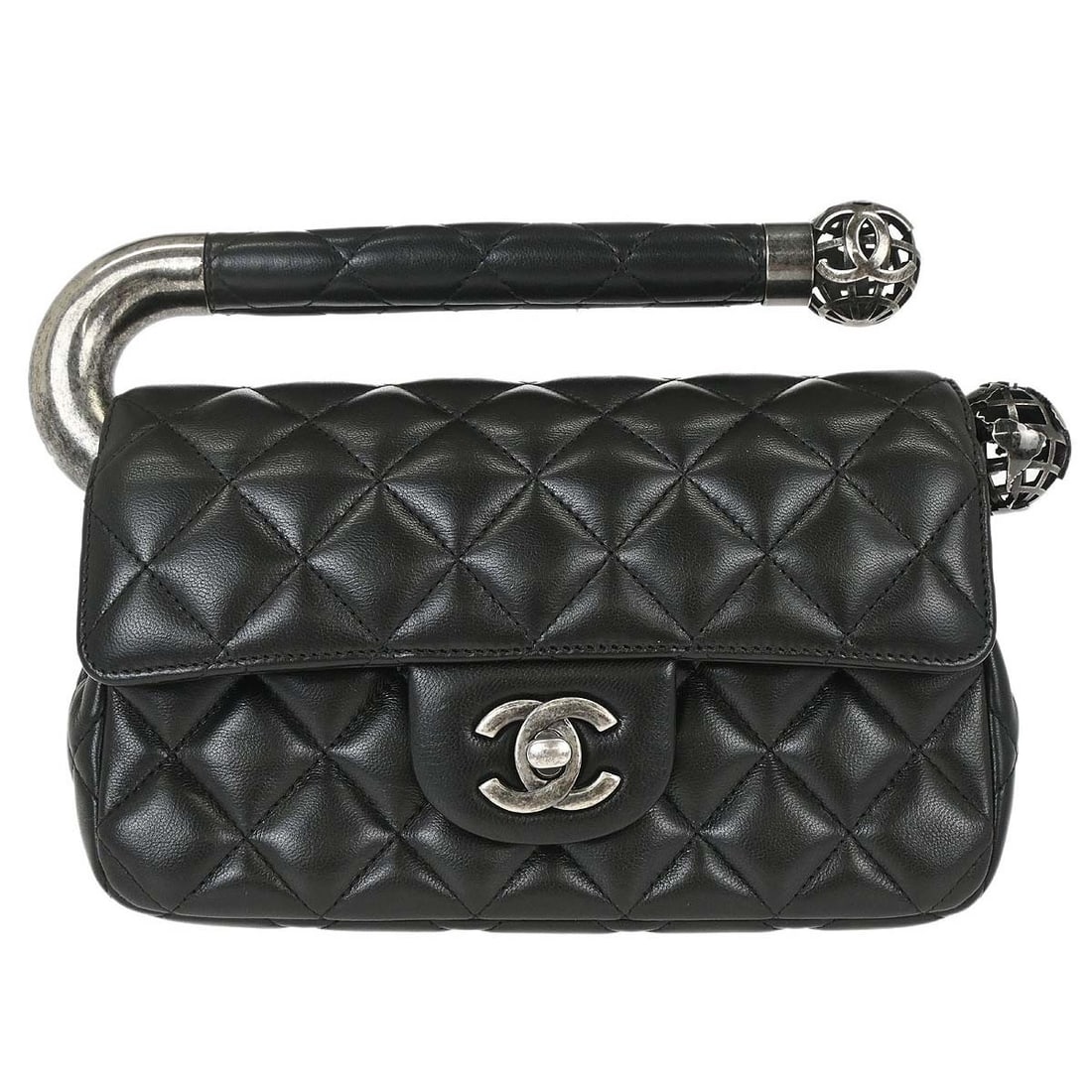 CHANEL Around the World Black Lambskin Top Handle Bag: CHANEL Around the World Black Lambskin Top Handle Bag This Chanel Black Lambskin Around the World handbag features a top handle design crafted from luxurious black leather. The bag is equipped with a 