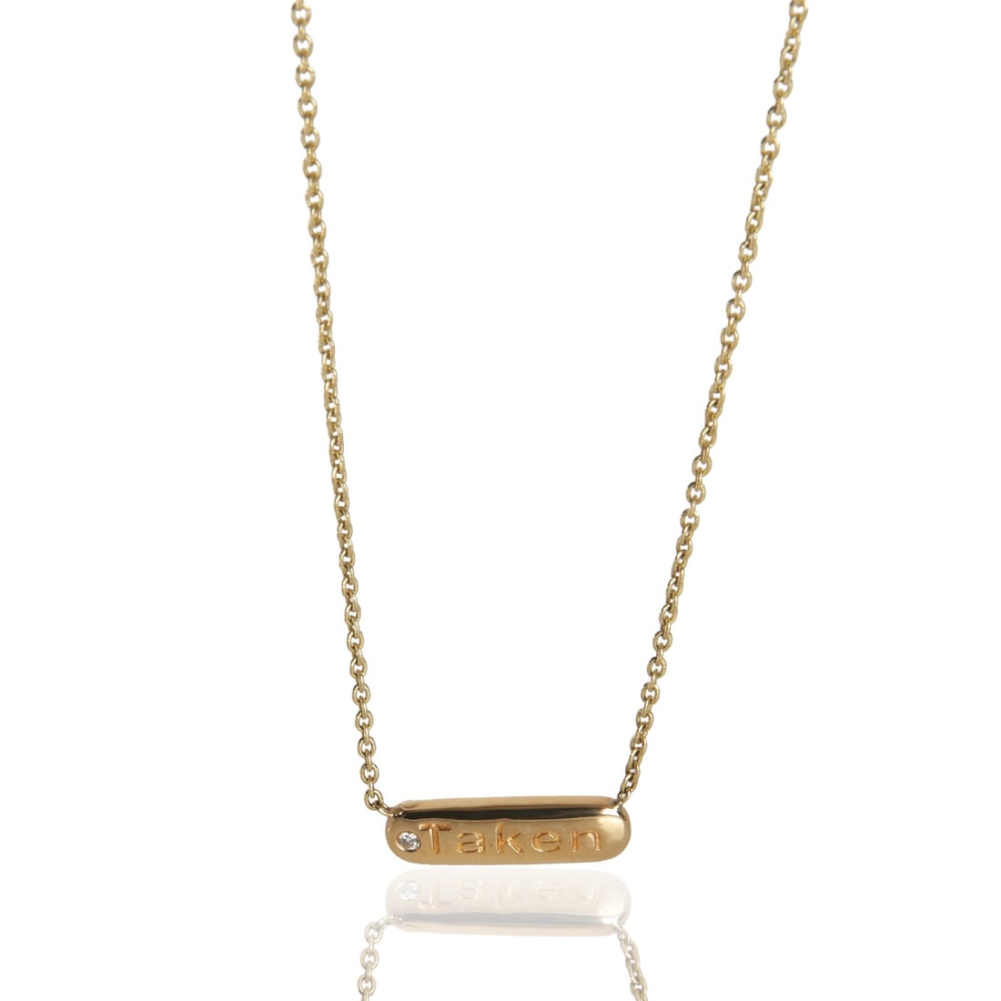 Mini Taken Collection 14K Yellow Gold Diamond Pendant: Mini Taken Collection 14K Yellow Gold Diamond Pendant This elegant pendant from the Mini Taken collection features a round brilliant white diamond set in 14K yellow gold. The pendant is designed for w