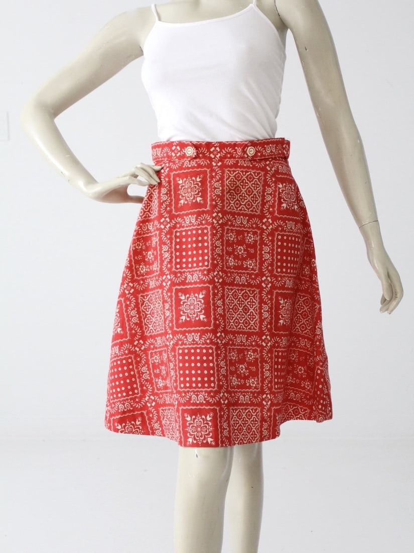 1970s Vintage Red White Bandana Print Mini Skirt: 1970s Vintage Red White Bandana Print Mini Skirt Step back in time with this charming vintage 1970s bandana print mini skirt. Crafted in a vibrant red and white A-line design, this skirt features styl
