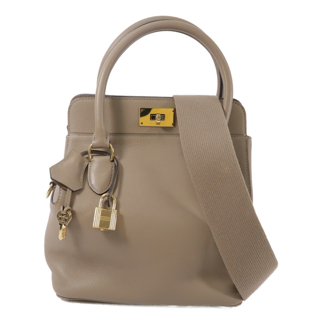 Hermes Tool Box 20 Evercolor Leather 2 Way Shoulder Bag GHW: Hermes Tool Box 20 Evercolor Leather 2 Way Shoulder Bag GHW This Hermes Tool Box 20 is a versatile 2-way shoulder bag crafted from Evercolor calfskin leather in a Gris Asphalte (gray-brown) tone. Made