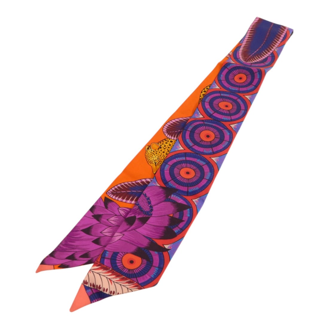 Hermes Silk Twilly Women's Scarf in Purple and Orange Multicolor: Hermes Silk Twilly Women's Scarf in Purple and Orange Multicolor This Hermes Twilly scarf is crafted from silk and features a vibrant purple, orange, and multicolor design. Made in France, it is desig