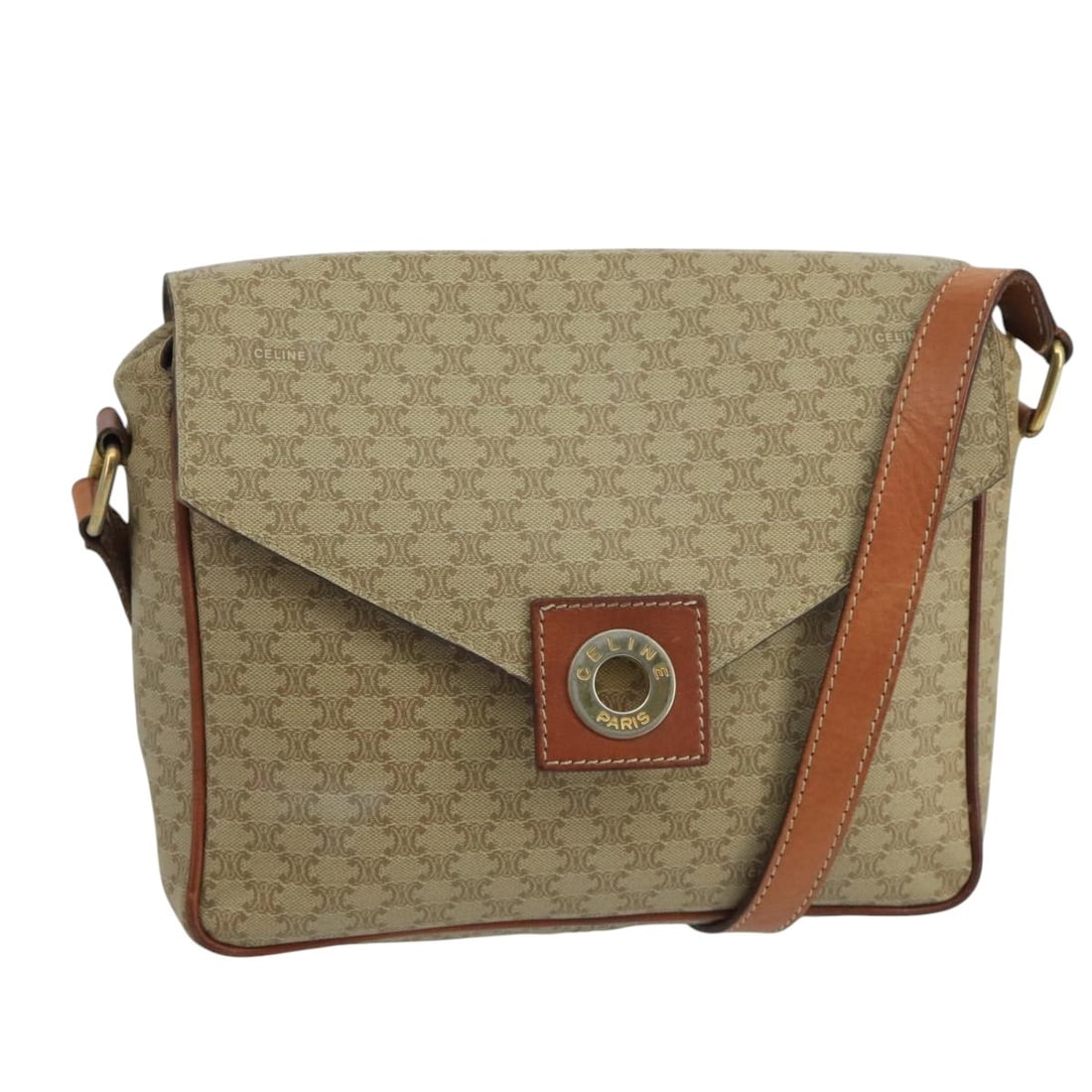 Celine Macadam Canvas Shoulder Bag with Circle Logo and Leather Trim: Celine Macadam Canvas Shoulder Bag with Circle Logo and Leather Trim This Celine Vintage Macadam Circle Logo Shoulder Bag features a classic beige canvas exterior with leather trim. The bag shows sign