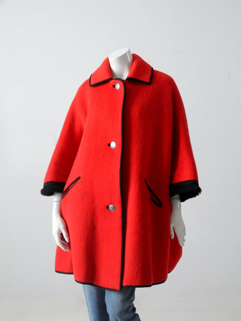 Vintage Tiroler Loden Cape Coat Red Wool Black Trim: Vintage Tiroler Loden Cape Coat Red Wool Black Trim Discover a timeless piece of fashion history with this vintage Austrian Tiroler Loden cape coat. Crafted from chic red wool, this elegant coat featu