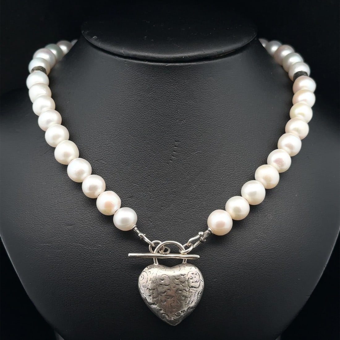 Cultured Pearl Sterling Silver Necklace with Heart Toggle Clasp: Cultured Pearl Sterling Silver Necklace with Heart Toggle Clasp This exquisite necklace features a stunning collection of genuine cultured pearls, beautifully crafted with a heart-shaped toggle clasp.