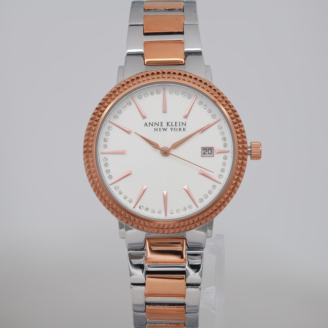 Anne Klein 36mm Two-Tone Ladies Quartz Watch with Crystal Dial: Anne Klein 36mm Two-Tone Ladies Quartz Watch with Crystal Dial This elegant Anne Klein wristwatch features a 36mm round case crafted from polished stainless steel in a sophisticated silver-tone finish