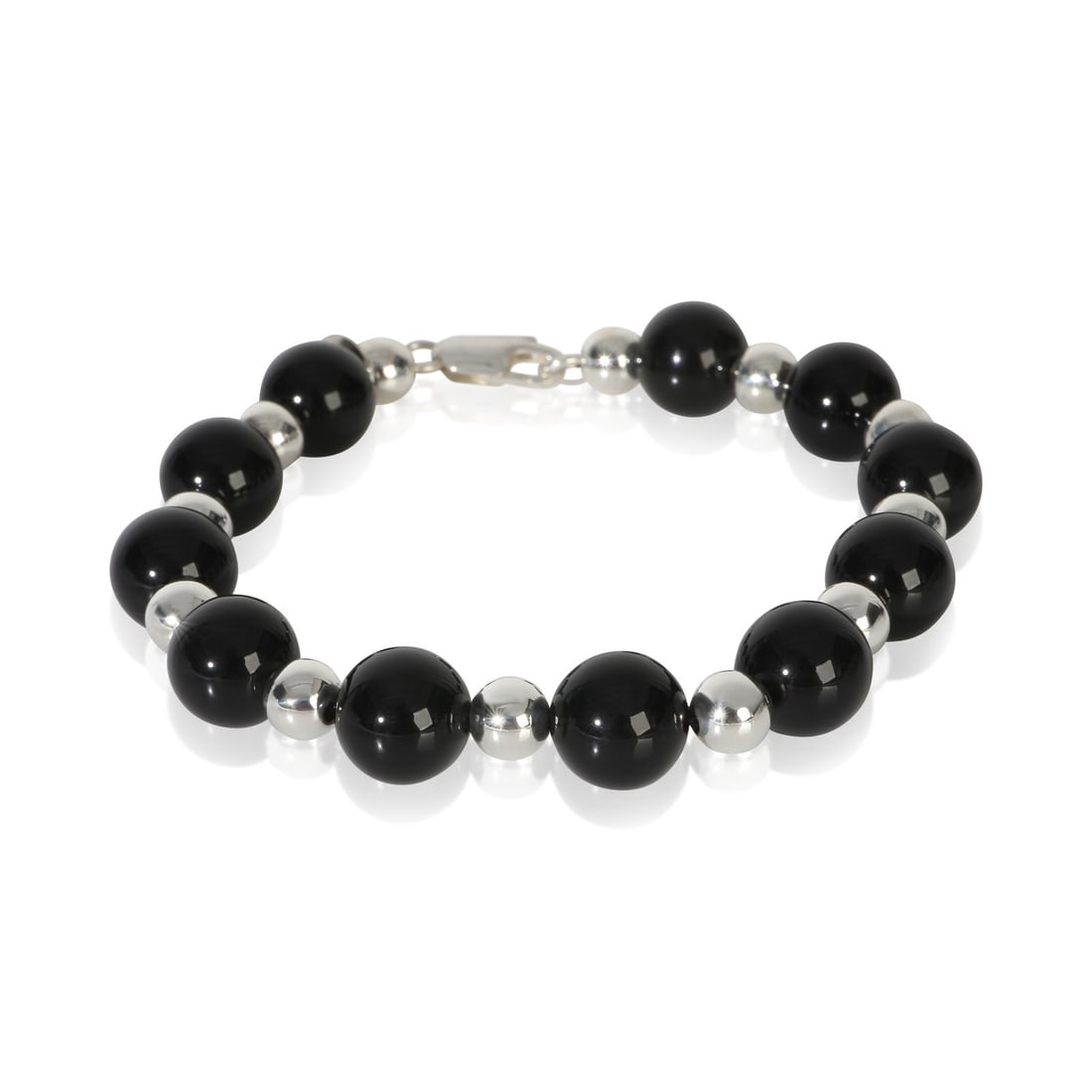 Tiffany & Co. Vintage Bead Onyx Sterling Silver Bracelet Box Pouch: Tiffany & Co. Vintage Bead Onyx Sterling Silver Bracelet Box Pouch This pre-owned Tiffany & Co. Vintage Bead bracelet features sterling silver beads accented with an onyx main stone. The bracelet has 