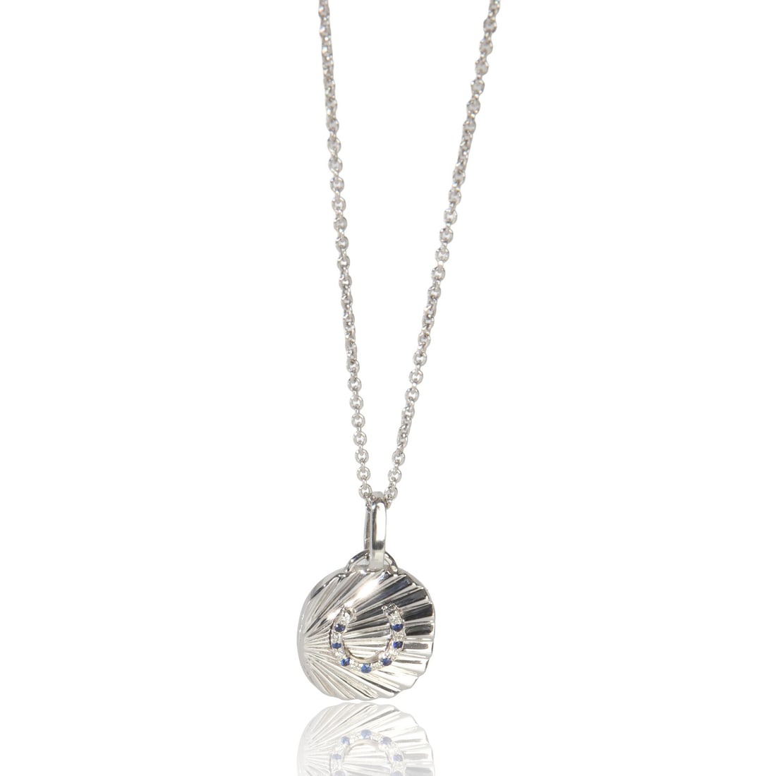 Oval Disc Horseshoe Pendant in 14K White Gold with Sapphire and Diamond Accents: Oval Disc Horseshoe Pendant in 14K White Gold with Sapphire and Diamond Accents This pre-owned women's pendant features an oval disc design with a horseshoe motif, crafted in 14K white gold. The penda