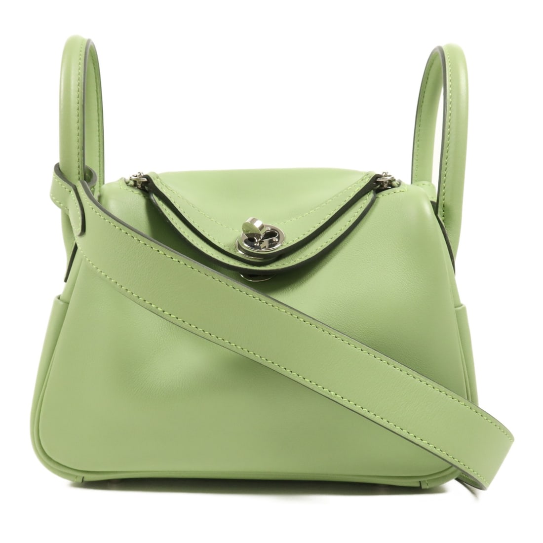 Hermes Mini Lindy Vert Criquet Swift Leather 2way Shoulder Bag PHW: Hermes Mini Lindy Vert Criquet Swift Leather 2way Shoulder Bag PHW This Hermes Mini Lindy 2-way shoulder bag is crafted from supple Swift calfskin leather in a vibrant green shade (Vert Criquet). Made
