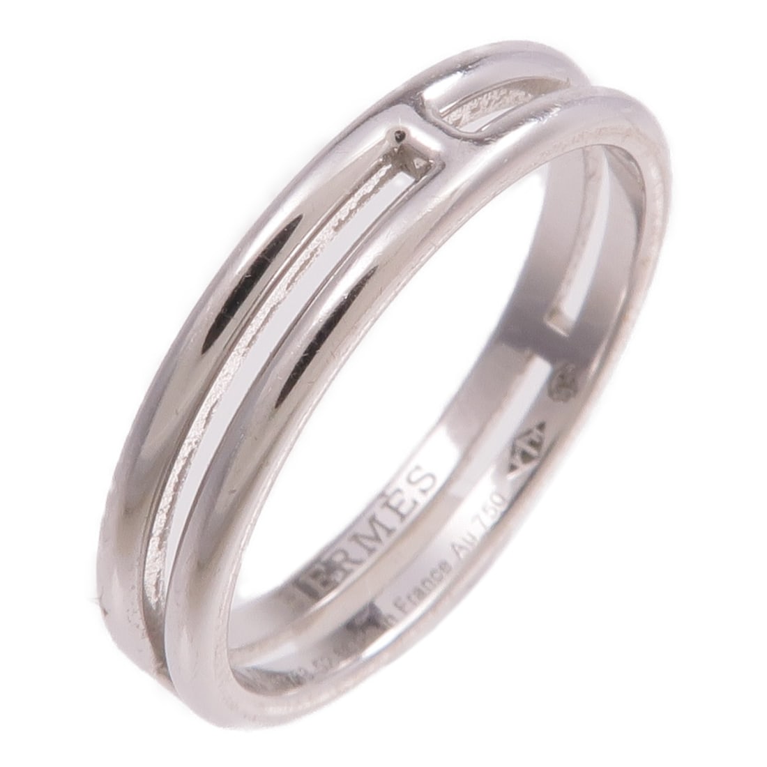 Hermes Ariane 18K White Gold Ring Size 52 US 6: Hermes Ariane 18K White Gold Ring Size 52 US 6 This HERMES Ariane ring is crafted from 18K white gold, featuring a sleek silver tone and a minimalist design with no main stone. Designed for women, the