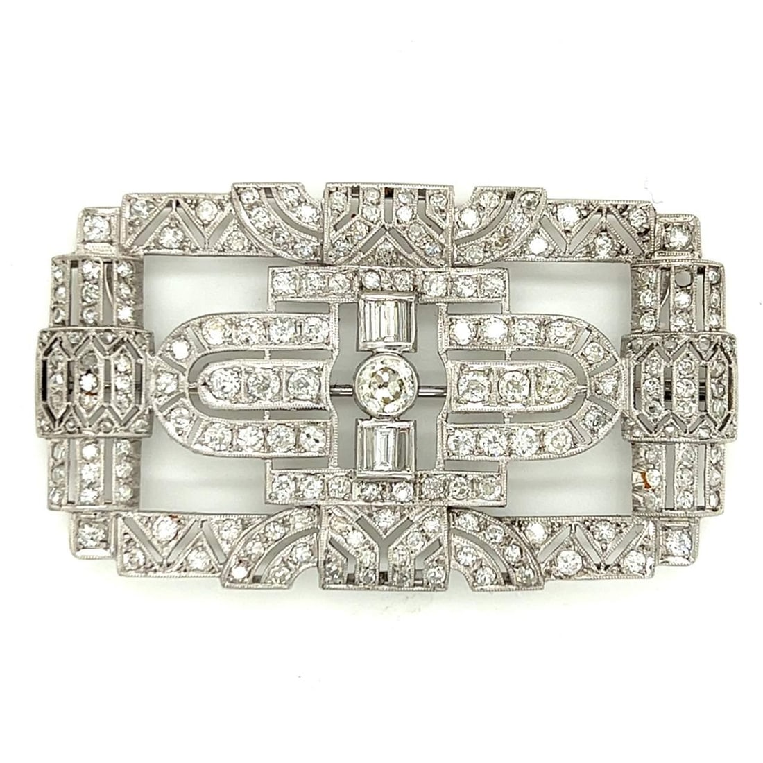 Art Deco Platinum Brooch 7.00 Ct Diamonds F-H Color VS1-SI2: Art Deco Platinum Brooch 7.00 Ct Diamonds F-H Color VS1-SI2 This exquisite Art Deco brooch is crafted in platinum and features approximately 7.00 carats of stunning diamonds, showcasing F-H color and 