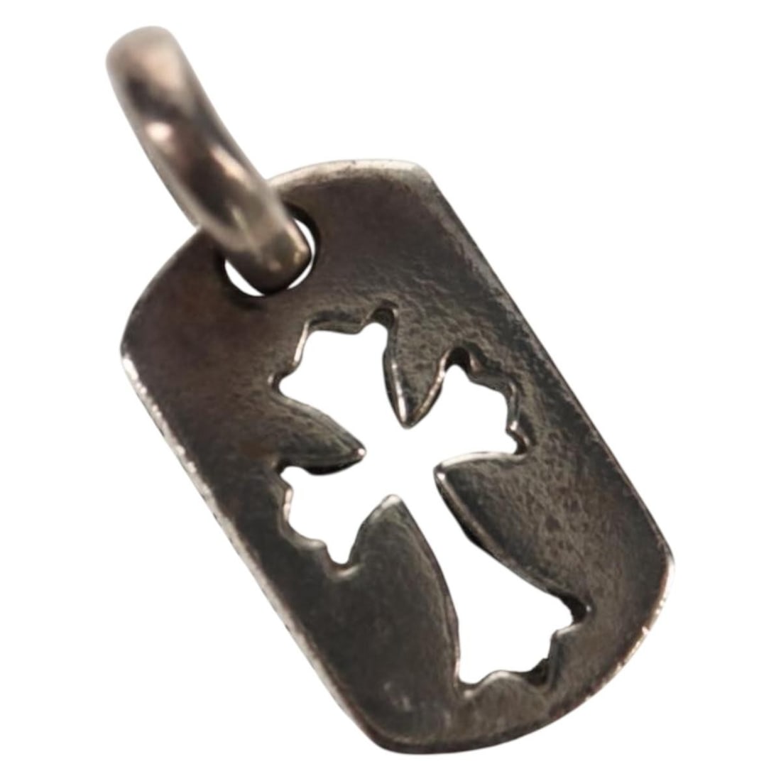 Chrome Hearts Silver Tiny Cross Dog Tag Pendant Necklace Accent: Chrome Hearts Silver Tiny Cross Dog Tag Pendant Necklace Accent This Chrome Hearts Tiny Cutout Cross Dog Tag Pendant is crafted from Ag925 silver and features a cross cutout design. The pendant is in 