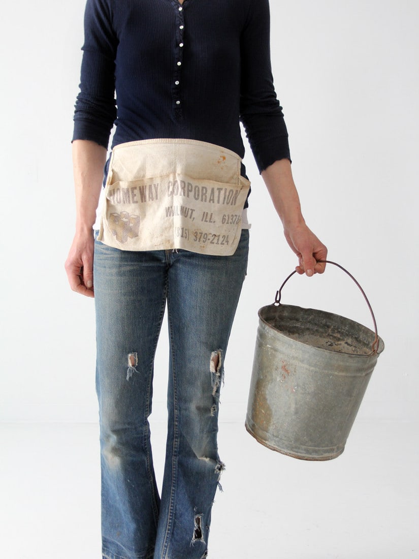 Vintage Homeway Corporation Cream Canvas Half Apron with Large Pockets: Vintage Homeway Corporation Cream Canvas Half Apron with Large Pockets This vintage work apron is crafted from cream canvas and features a charming half design, ideal for various tasks. Showcasing the