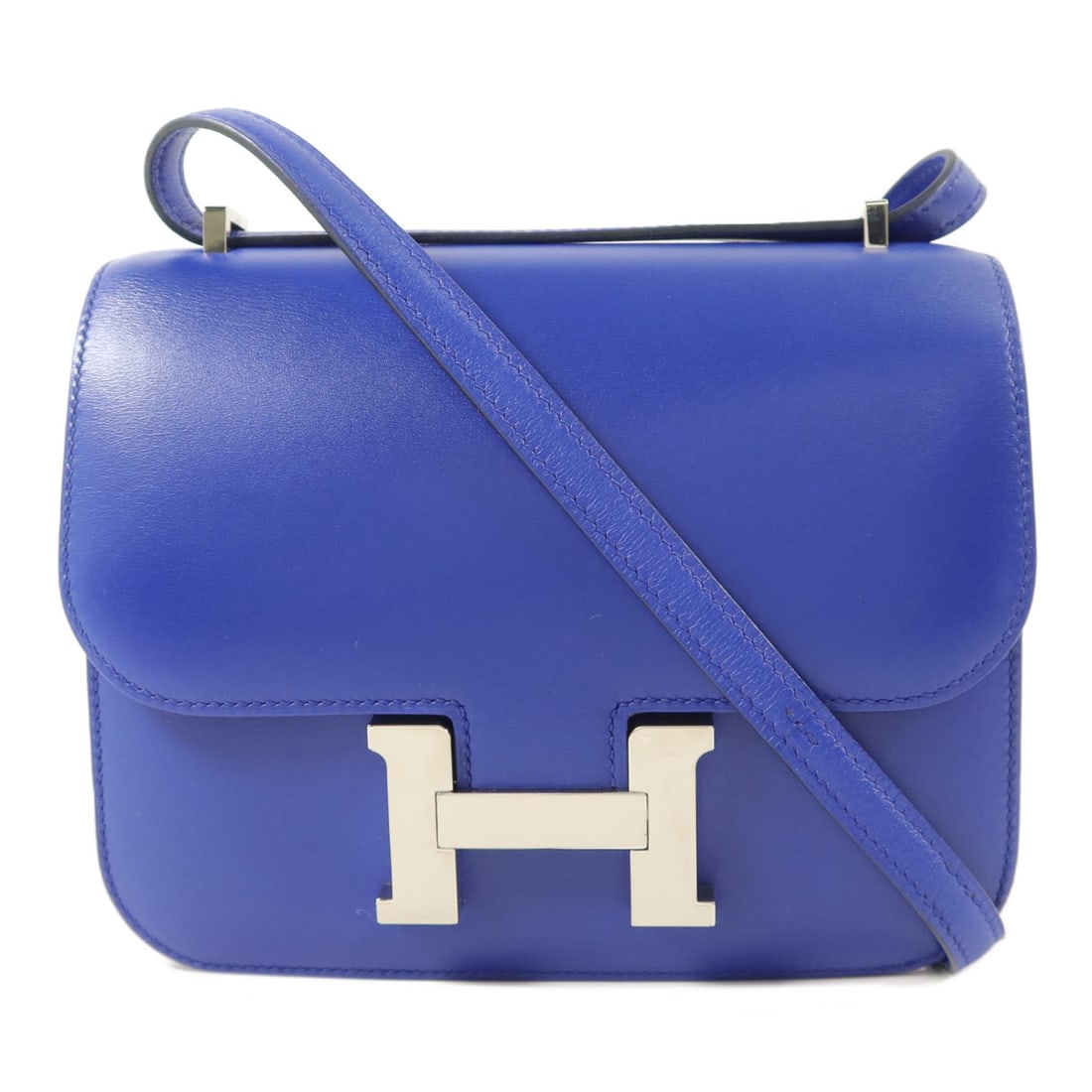 Hermes Constance Mini Bleu Electrique Calfskin Shoulder Bag PHW: Hermes Constance Mini Bleu Electrique Calfskin Shoulder Bag PHW This Hermes Constance Mini shoulder bag is crafted from premium Tadelakt calfskin leather in a striking Bleu Electrique color. Designed 