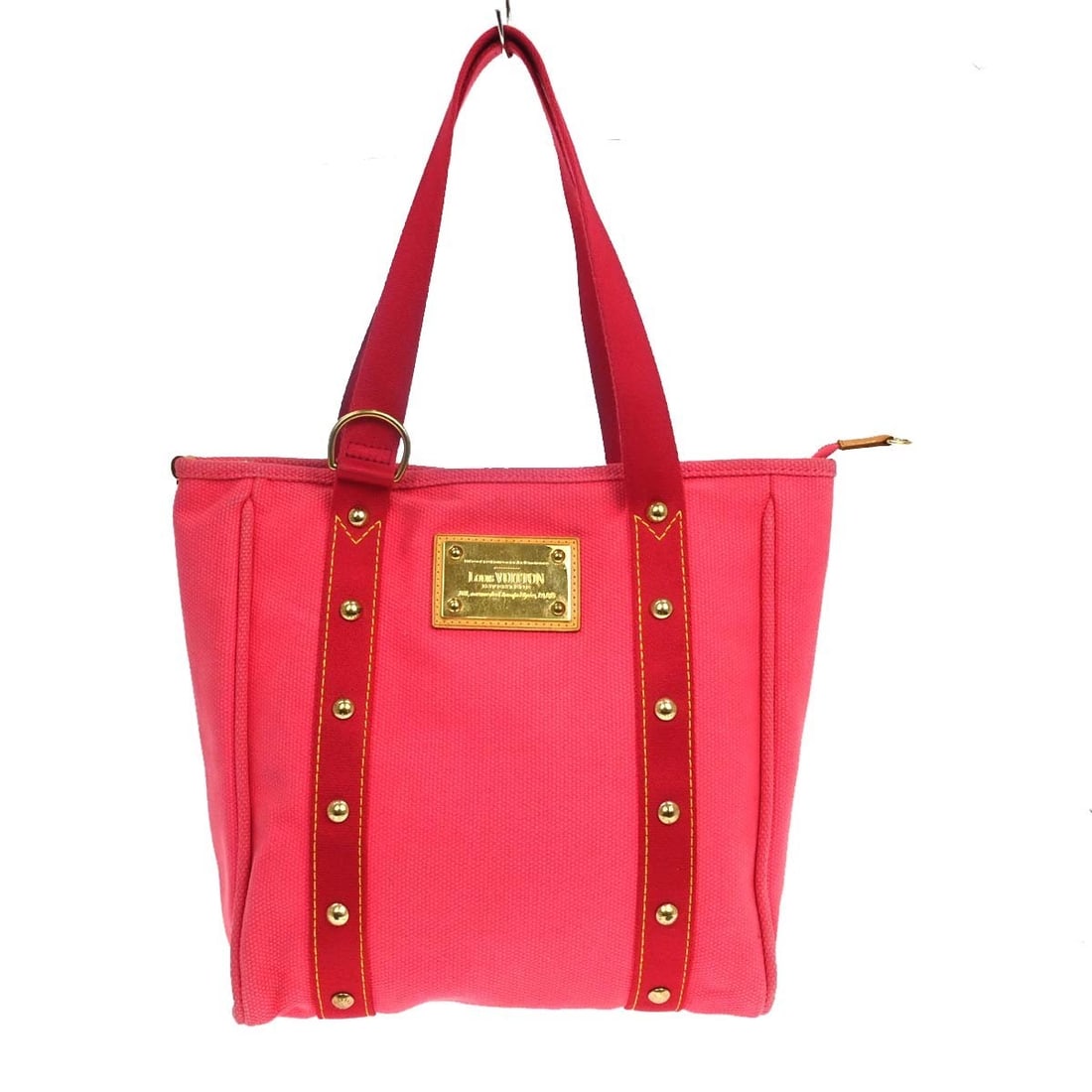 Louis Vuitton Antigua Cabas MM pink canvas tote bag: Louis Vuitton Antigua Cabas MM pink canvas tote bag This Louis Vuitton Antigua Cabas MM tote bag features a pink canvas exterior with matching double handles and a zip closure. The medium-sized tote o