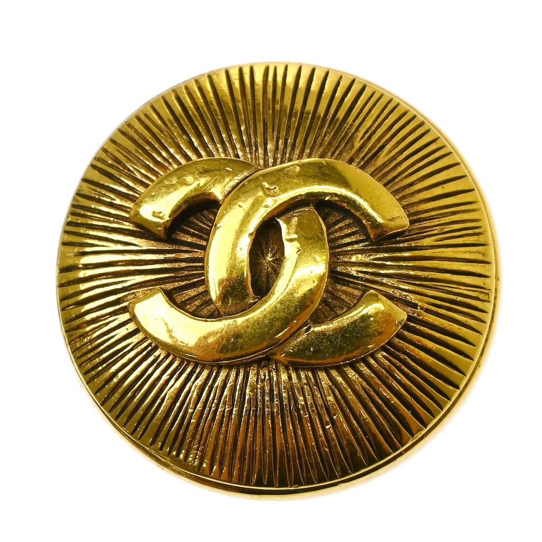 Chanel logo brooch pin yellow gold plated: Chanel logo brooch pin yellow gold plated This Chanel brooch features the iconic logo design in a gold color with a yellow gold plated finish. Crafted in France, it showcases the brand's signature ele