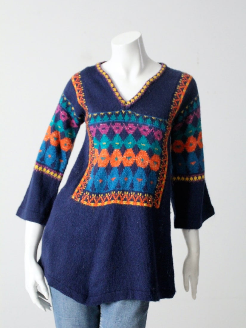 1970s Vintage Boho Acrylic Knit Pullover Sweater: 1970s Vintage Boho Acrylic Knit Pullover Sweater Embrace the retro charm of the 1970s with this vintage boho knit pullover sweater. Crafted from soft navy blue acrylic, this stylish top features a fla