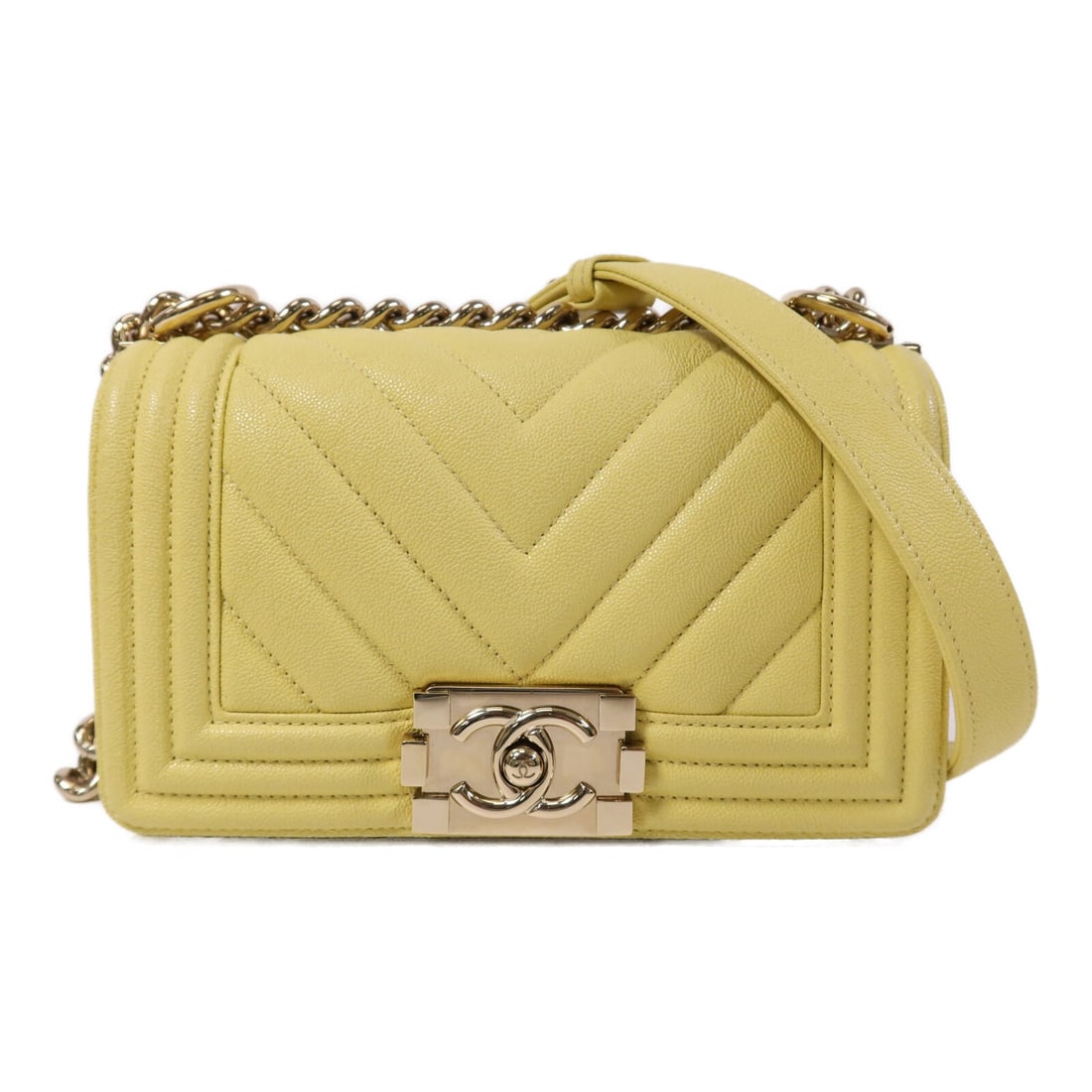 Yellow Calfskin Boy 20 Chain Shoulder Bag by CHANEL with Gold Hardware: Yellow Calfskin Boy 20 Chain Shoulder Bag by CHANEL with Gold Hardware This CHANEL Boy shoulder bag features a yellow calfskin leather exterior with gold-tone hardware accents. Designed for women, it 