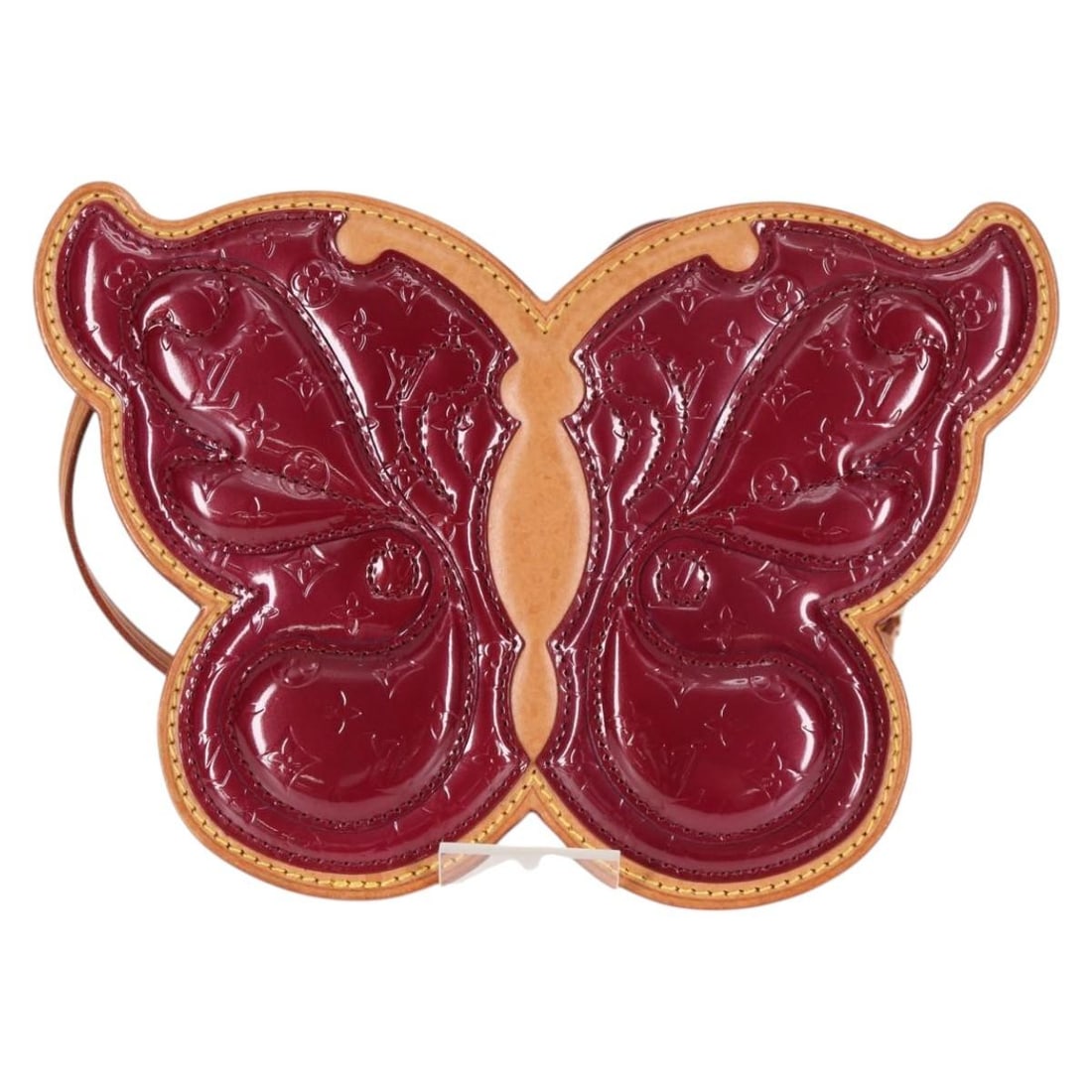 Conte de Fees Butterfly Burgundy Patent Leather Crossbody by Louis Vuitton: Conte de Fees Butterfly Burgundy Patent Leather Crossbody by Louis Vuitton This Louis Vuitton Conte de Fees Butterfly Crossbody Bag features the signature Monogram Vernis in a rich burgundy patent lea