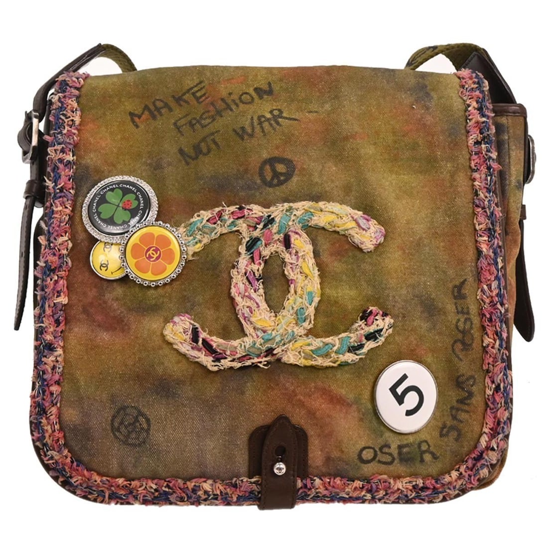Chanel On The Pavements Khaki Canvas Shoulder Bag: Chanel On The Pavements Khaki Canvas Shoulder Bag This Chanel shoulder bag from the On The Pavements collection features a khaki canvas and leather exterior with a graffiti-inspired design. It has a m