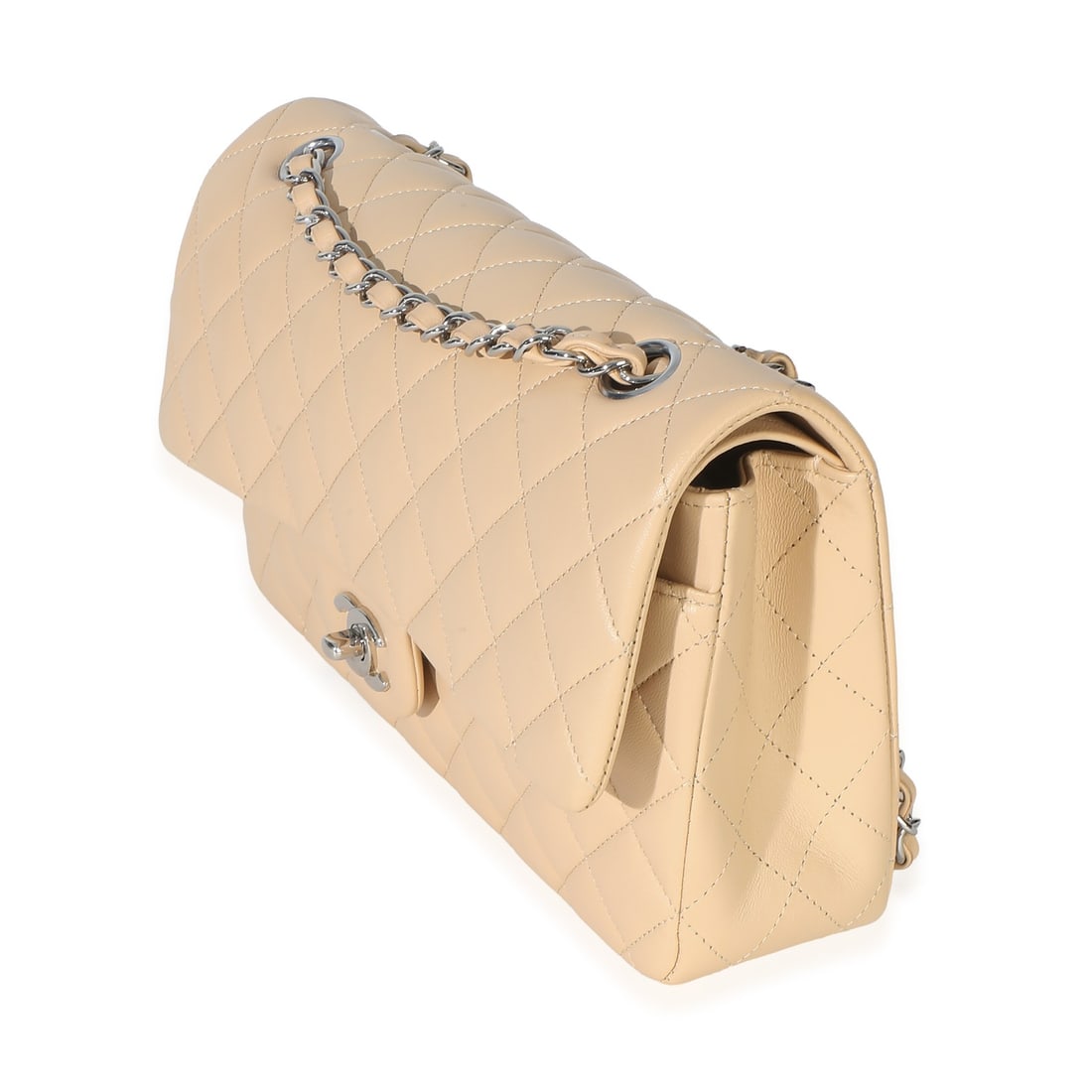 Chanel Beige Quilted Lambskin Flap Shoulder Bag Silver Tone: Chanel Beige Quilted Lambskin Flap Shoulder Bag Silver Tone This Chanel Classic Double Flap Bag features luxurious beige quilted lambskin leather with a silver-tone turnlock closure. Designed as a sho