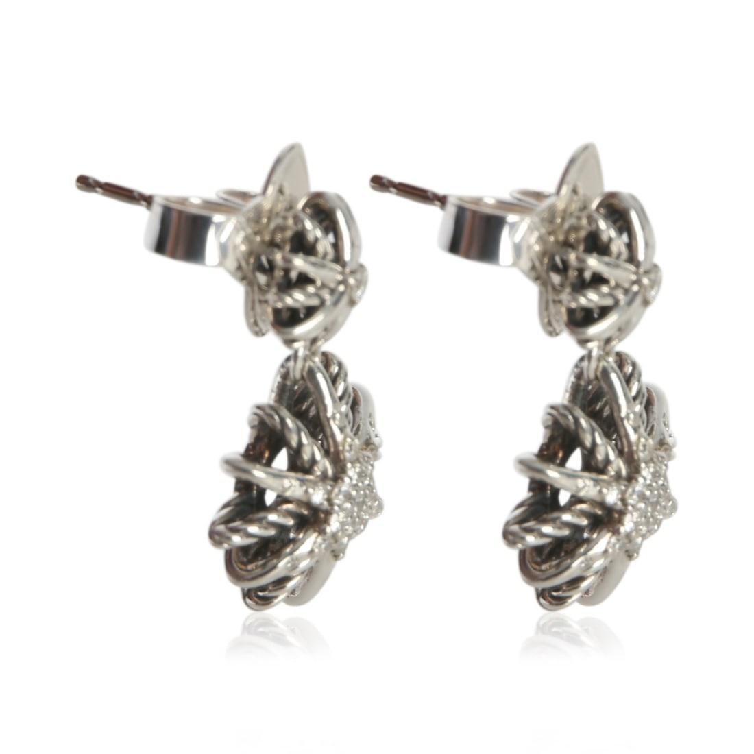 David Yurman Starburst Sterling Silver Diamond Earrings: David Yurman Starburst Sterling Silver Diamond Earrings These pre-owned David Yurman Starburst earrings are crafted from sterling silver and feature round brilliant white diamonds. The earrings have a
