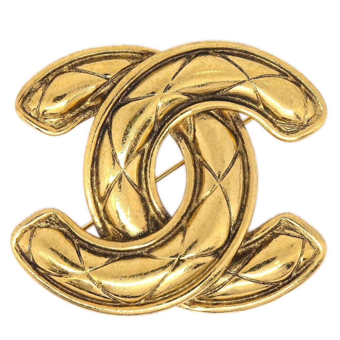 Gold Tone Large Brooch with Quilted CC Logo by Chanel: Gold Tone Large Brooch with Quilted CC Logo by Chanel This Chanel brooch features the iconic quilted CC logo in a large size. Crafted from gold-plated metal, it presents a stylish and recognizable acc