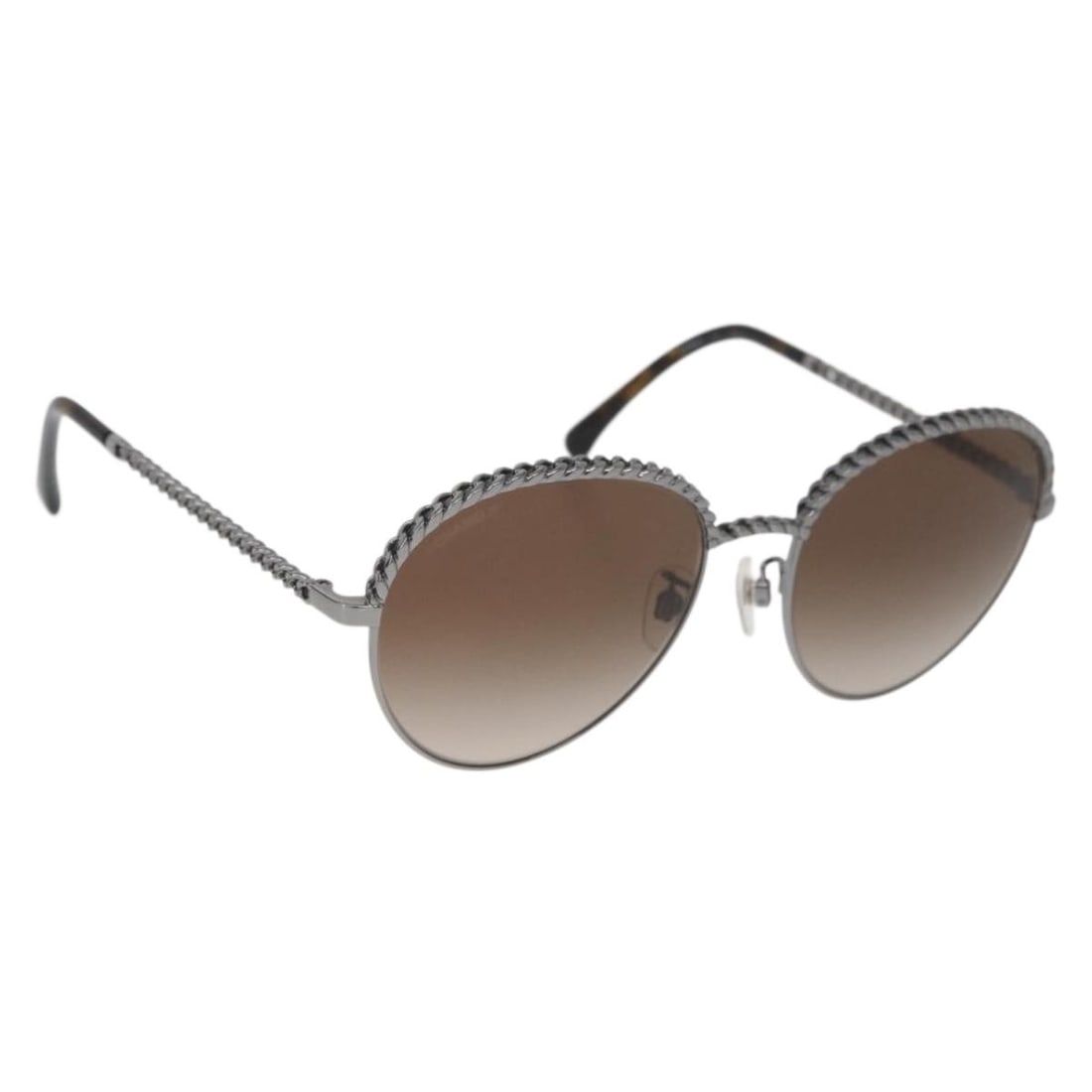 CHANEL Silver Metal Sunglasses with Case: CHANEL Silver Metal Sunglasses with Case These CHANEL sunglasses feature a sleek silver metal frame and the iconic CC logo, offering a sophisticated accessory for women. Made in Italy, they come with 