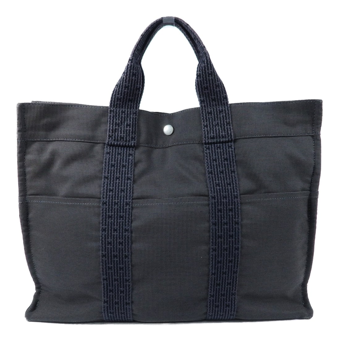 Hermes Fourre Tout MM Canvas Tote with Palladium Hardware in Grey: Hermes Fourre Tout MM Canvas Tote with Palladium Hardware in Grey This Hermes Fourre Tout Tote MM is crafted from durable canvas in a versatile grey color. Designed as a tote bag, it offers ample spac