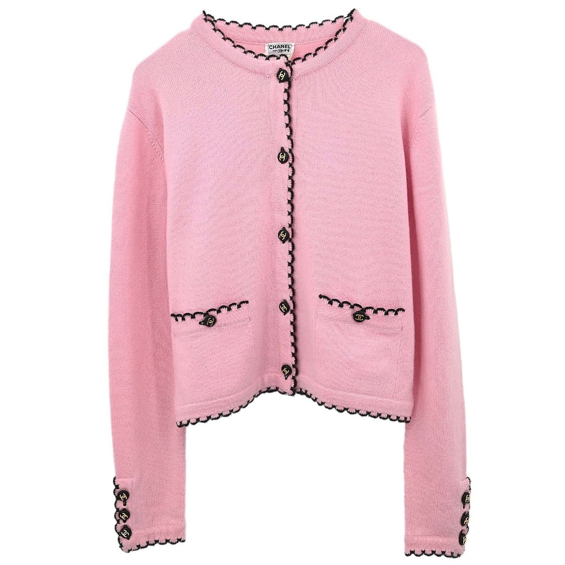 CHANEL Pink Cashmere Knit Button Logo Cardigan Size 42: CHANEL Pink Cashmere Knit Button Logo Cardigan Size 42 This vintage Chanel cardigan features a classic pink knit design crafted from 100% cashmere, offering both luxury and comfort. Detailed with sign