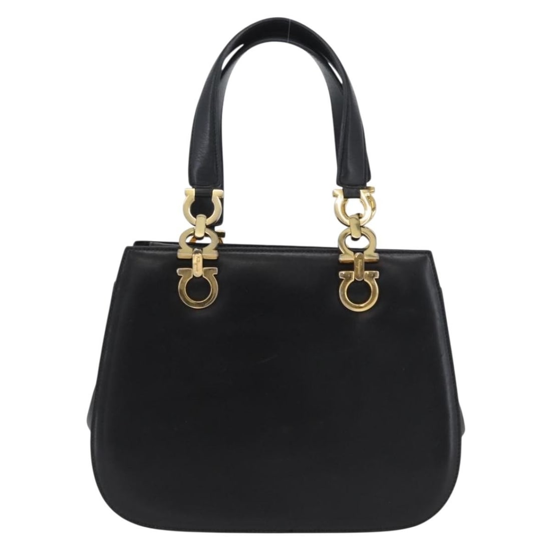 Black Leather Gancini Purse by Salvatore Ferragamo Italy: Black Leather Gancini Purse by Salvatore Ferragamo Italy This Salvatore Ferragamo Gancini handbag is crafted from black leather and designed for women. Made in Italy, the bag features a structured sil